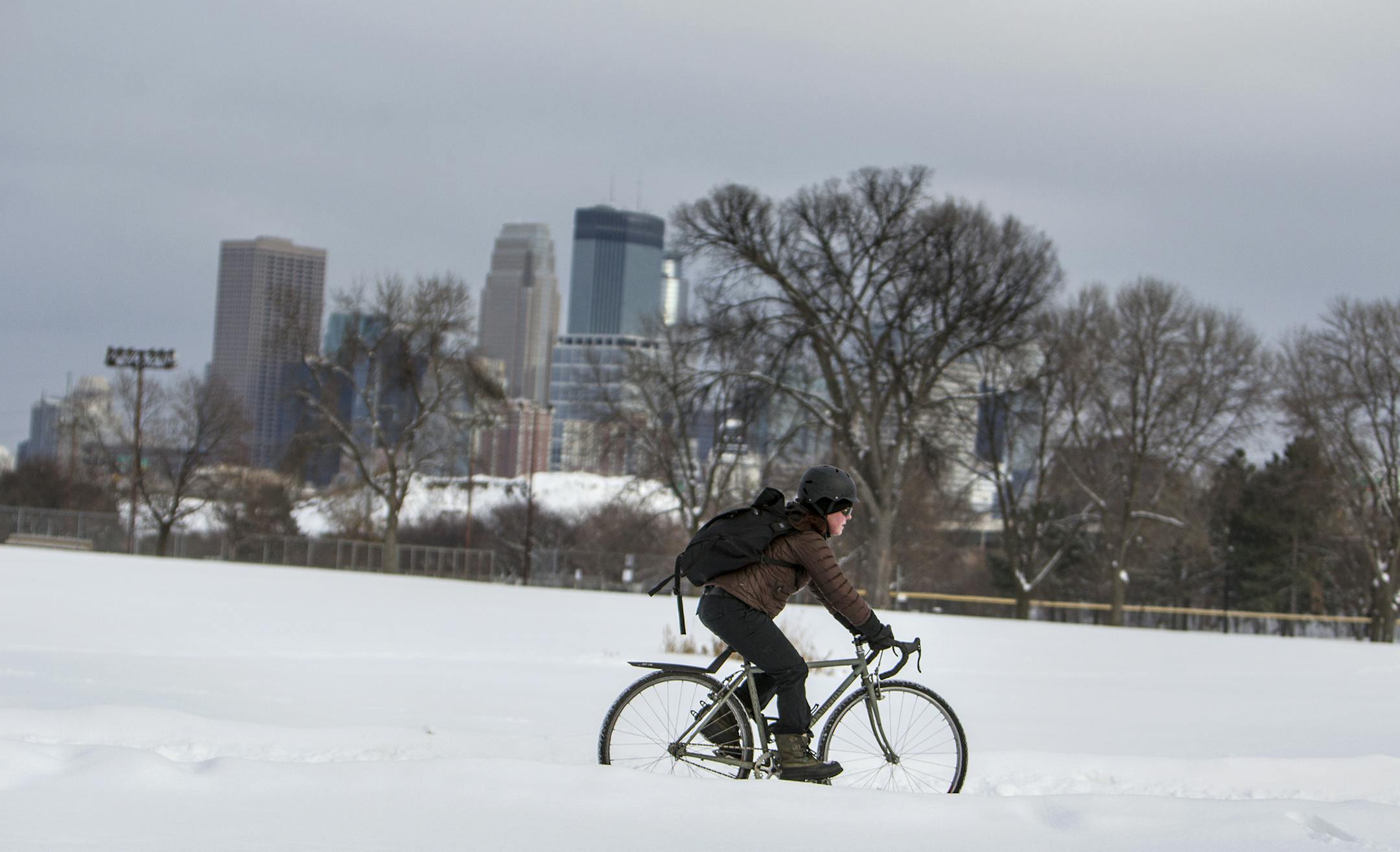 An intrepid cyclist made his way through Bryn Mawr Meadows toward the Cedar Lake and Kenilworth trails in Minneapolis on Wednesday. He and others braved temperatures in the teens to the low 20s. Was his backpack full of presents? He didn’t stop to say.