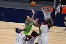 Minnesota Timberwolves' Juancho Hernangomez&nbsp; shoots after being fouled by New Orleans Pelicans' Kira Lewis Jr. (13) during the second half