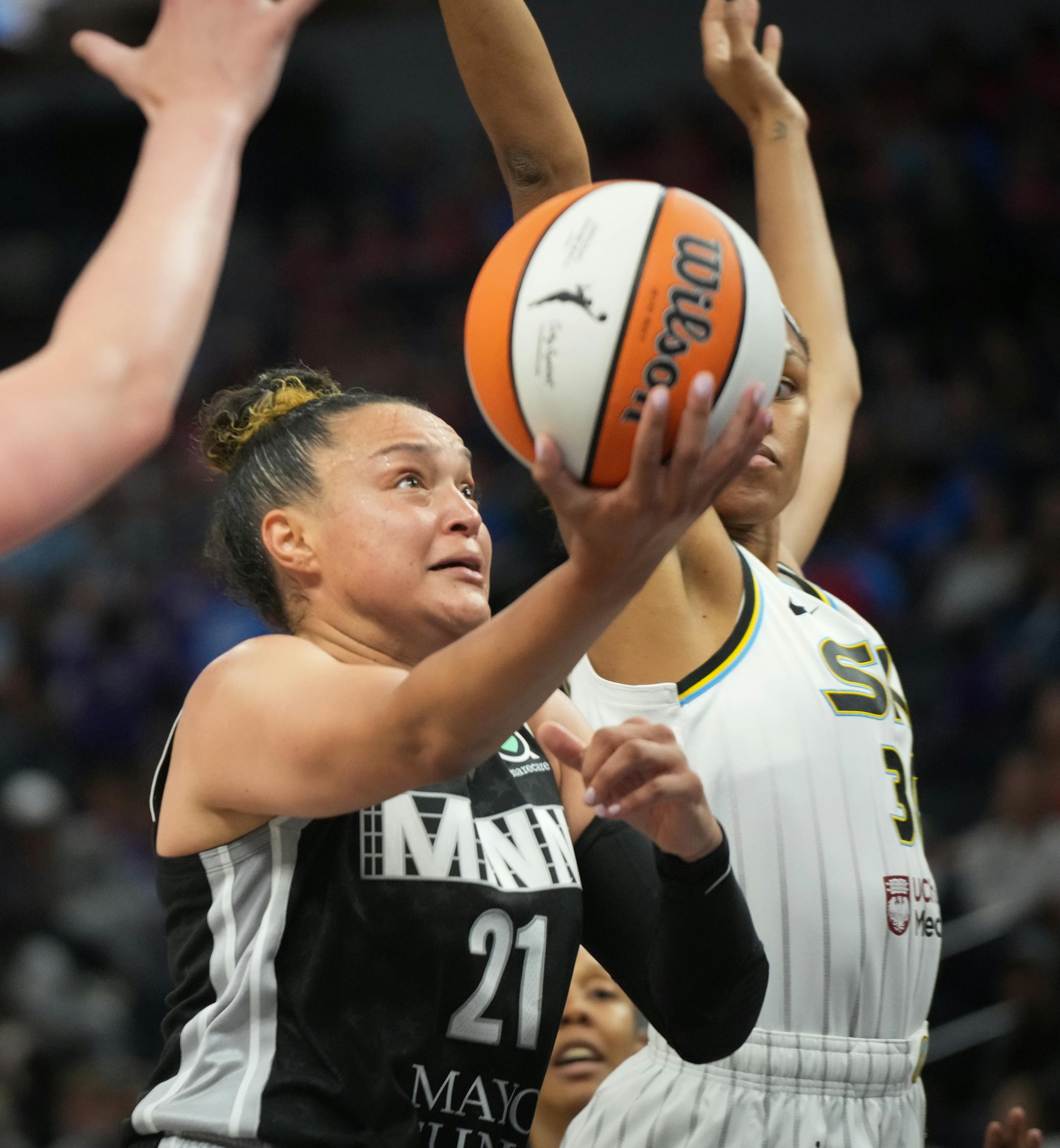 Minnesota Lynx guard Kayla McBride (21) drives to the hoop while guarded by Chicago Sky forward Azura Stevens (30) in the first half.