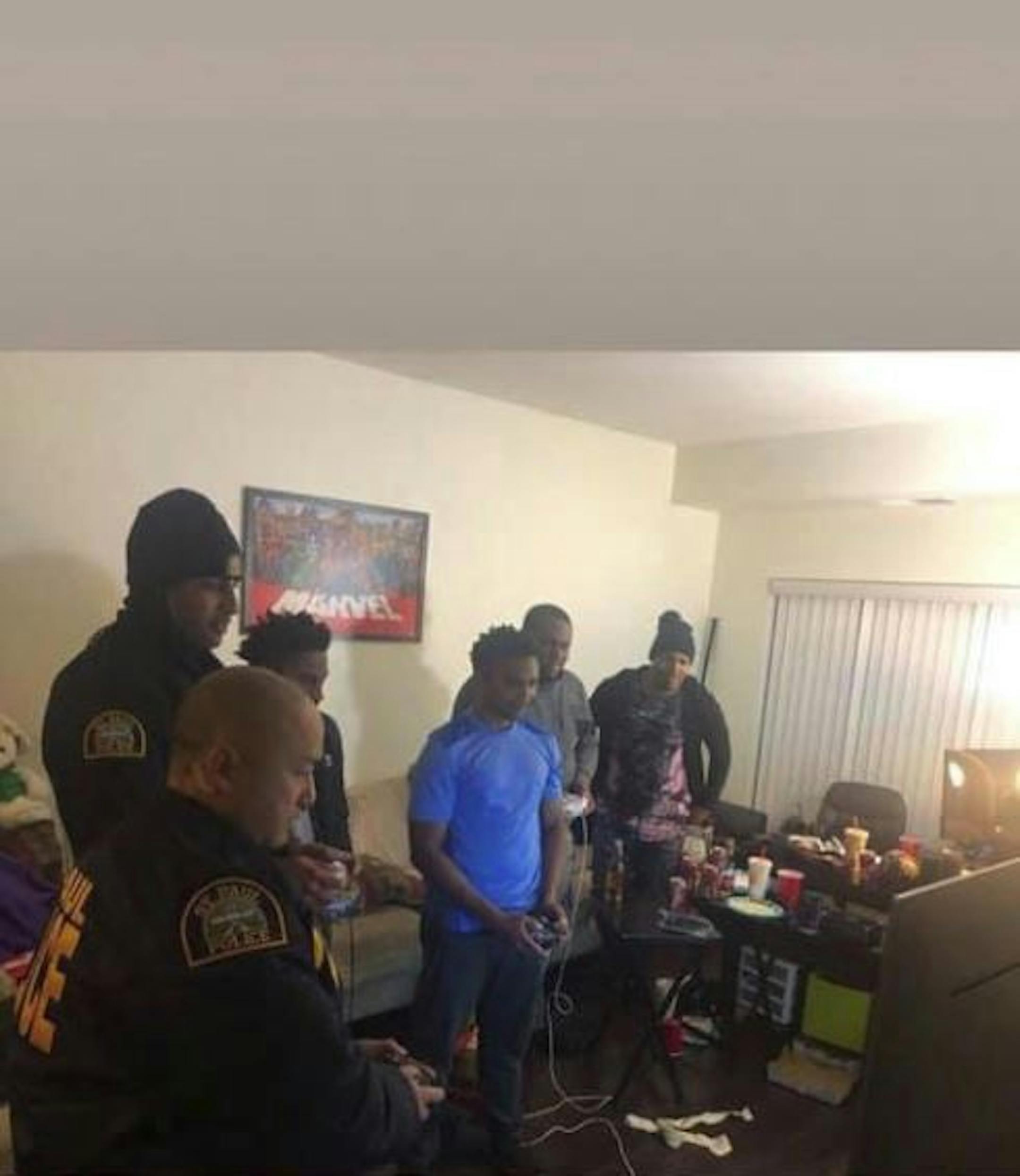 St. Paul police officers responding to a noise complaint were invited inside to play video games Friday night, captured in a Facebook post by Jovante Williams that has gone viral.
