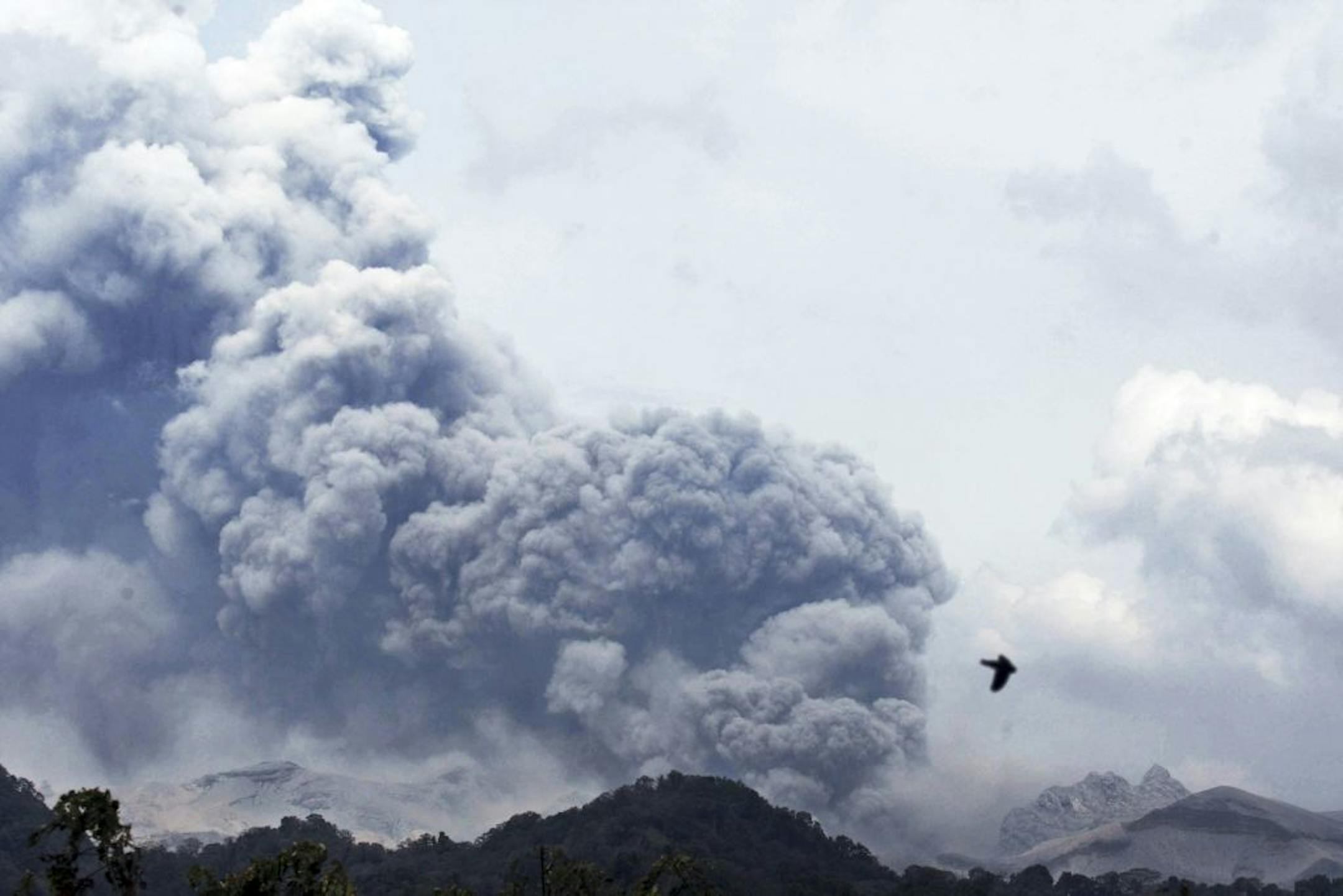 Mount Kelud erupts, as seen from Anyar village in Blitar, East Java, Indonesia, Friday, Feb. 14, 2014.