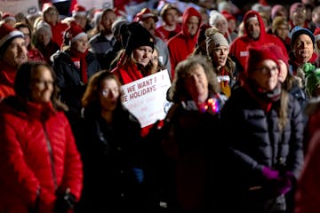 Teachers in the Anoka-Hennepin school district recently approved a new contract. In this photo, union members, teachers and supporters rallied outside