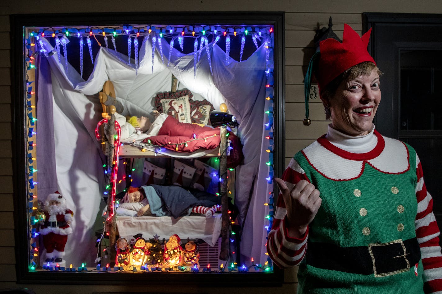 Lesley Ernst and her sister Jill Pederson share a display of the elves from the former Dayton's/Macy's eighth-floor holiday displays. Ernst bought the set for $30.