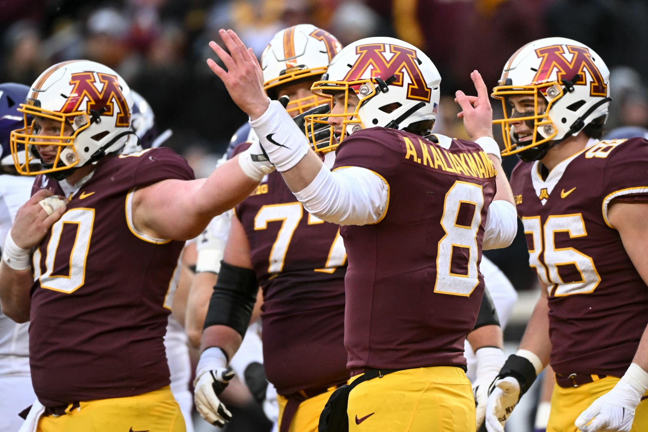 Minnesota Gophers quarterback Athan Kaliakmanis (8) celebrates a rushing touchdown by running back Mohamed Ibrahim (24) during the first half.