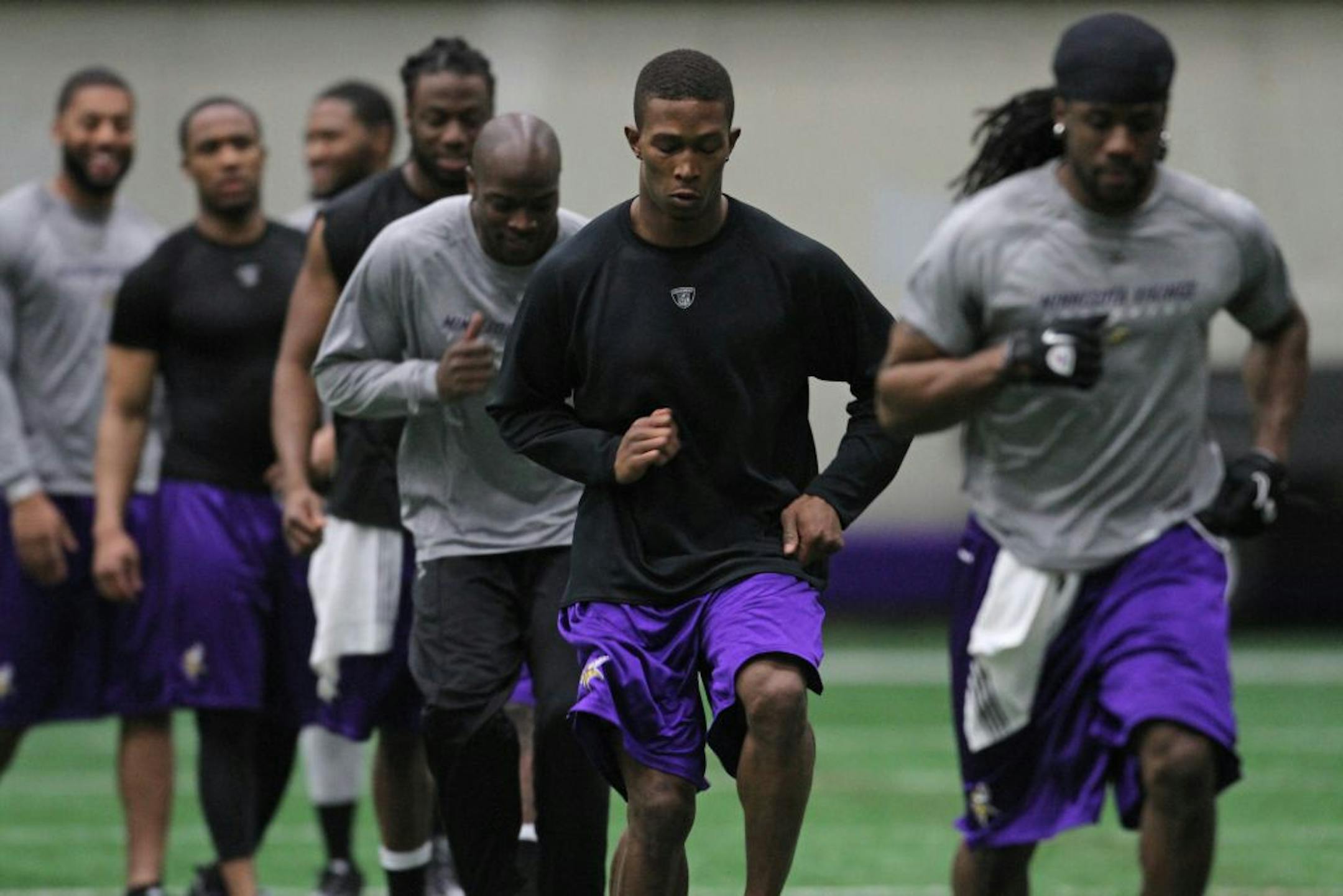 Vikings cornerback Chris Cook (center) at Winter Park in May.