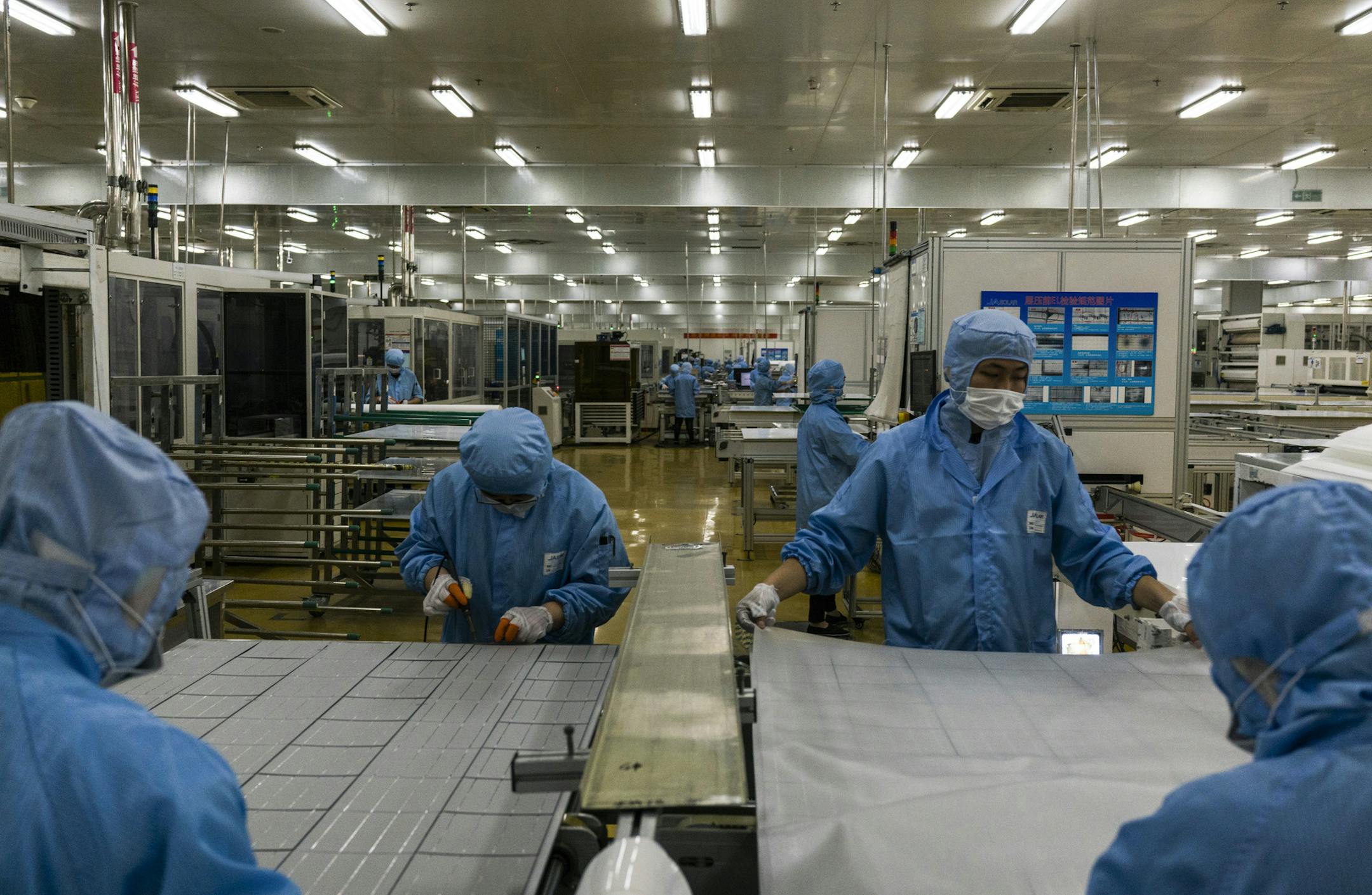 FILE -- Solar panels are assembled at a manufacturing plant in Hefei, China, June 5, 2017. The United States accuses China of swamping the market with cheap, subsidized solar panels, but those panels are increasingly made in other countries. (Adam Dean/The New York Times)