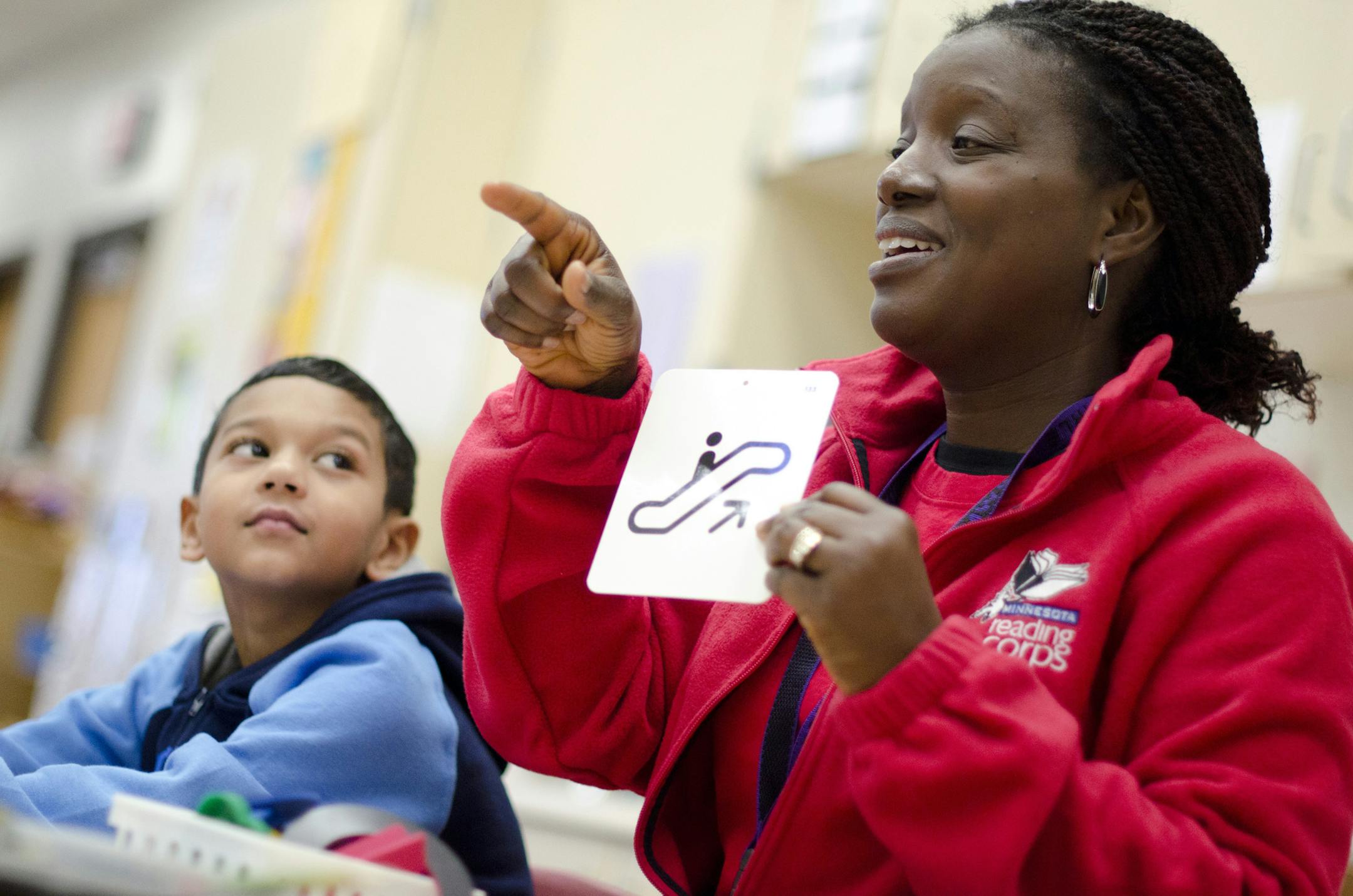 A member of the Minnesota Reading Corps helps tutor a student. Photo provided by Minnesota Reading Corps.