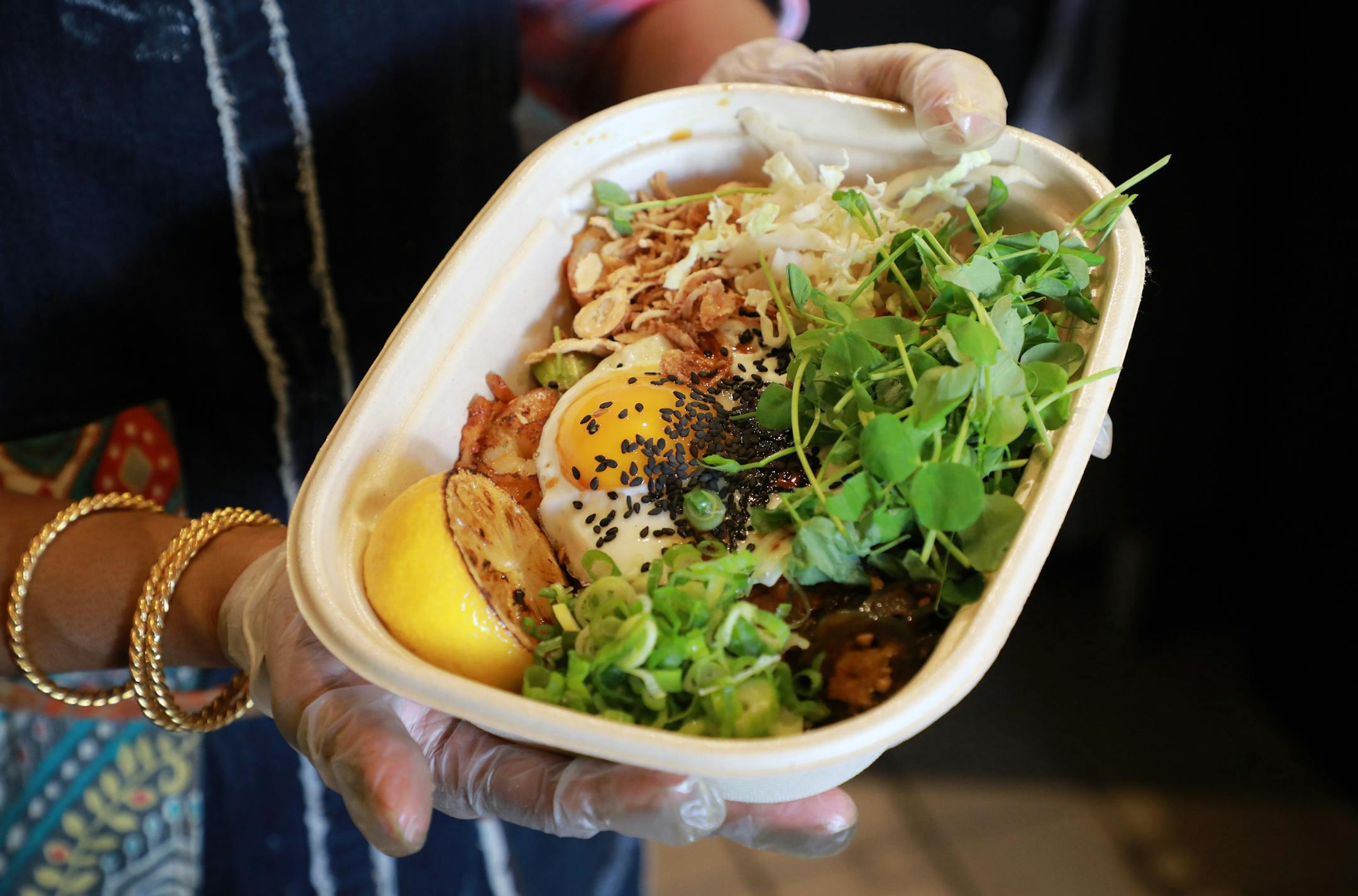 A dish of mee mamak, with shrimp, egg and turmeric noodles, a popular dish on the menu at Azalina Eusope's restaurant Mahila in San Francisco on June 4, 2020. Eusope is keeping busy during the pandemic with a diverse business model that has allowed her to improvise and generate revenue. (Jim Wilson/The New York Times) ORG XMIT: XNYT79