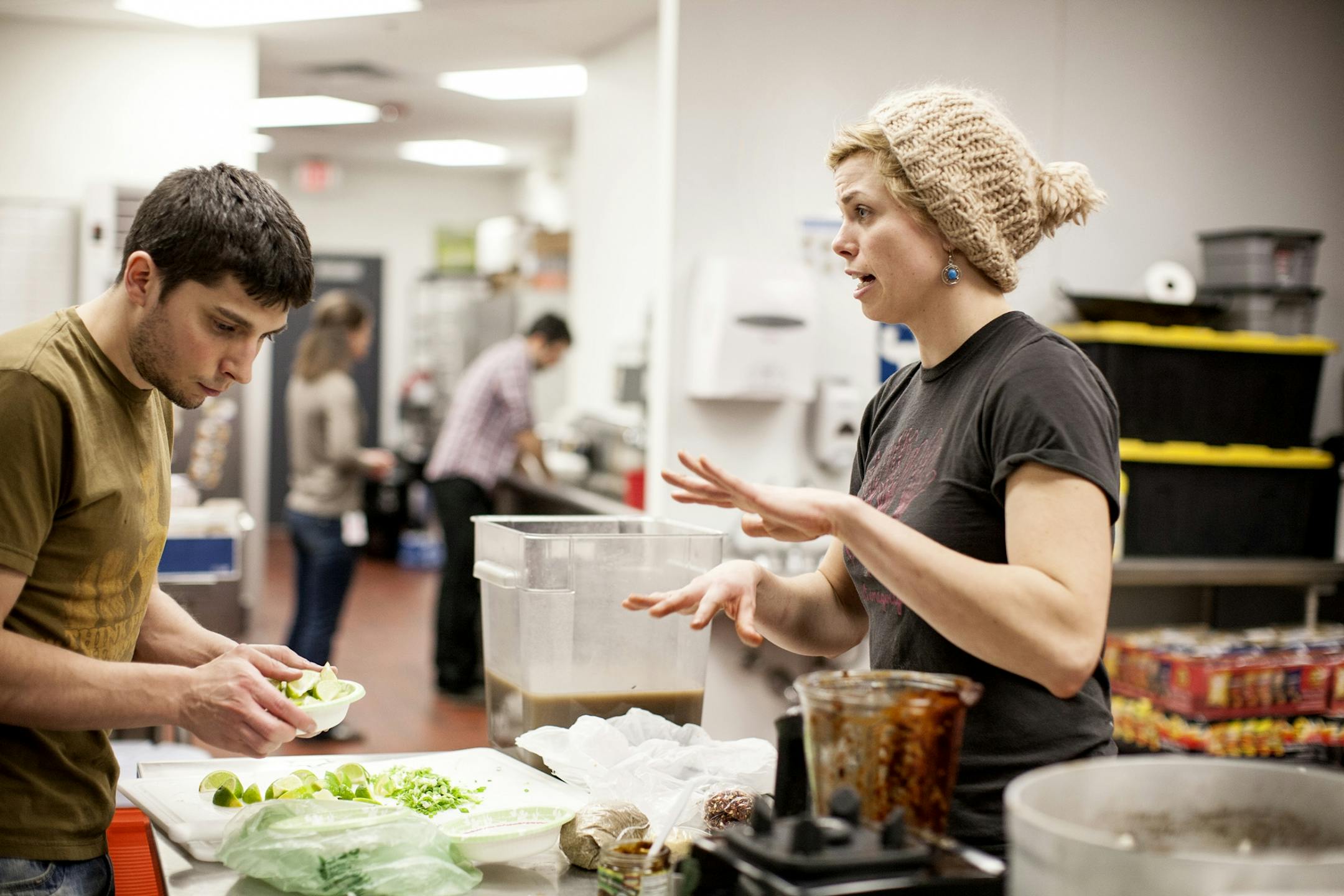 Founder Emily Torgrimson, right, prepares a meal with Casey Malone, left, and a team of volunteers at Eat for Equity's community feast benefitting Urban Ventures at the Urban Ventures headquarters in Minneapolis January 31, 2015.