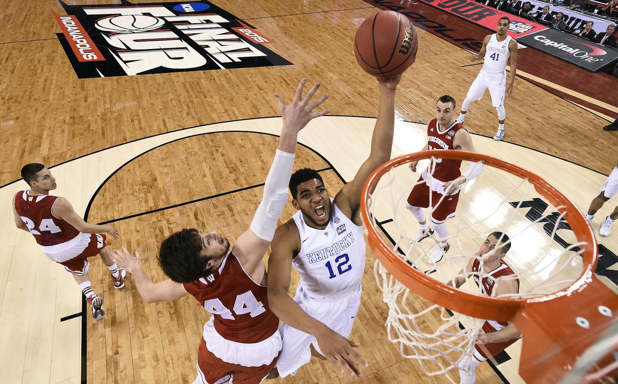 Karl-Anthony Towns drove to the basket past Wisconsin's Frank Kaminsky (44) during the first half of the NCAA Final Four national semifinal