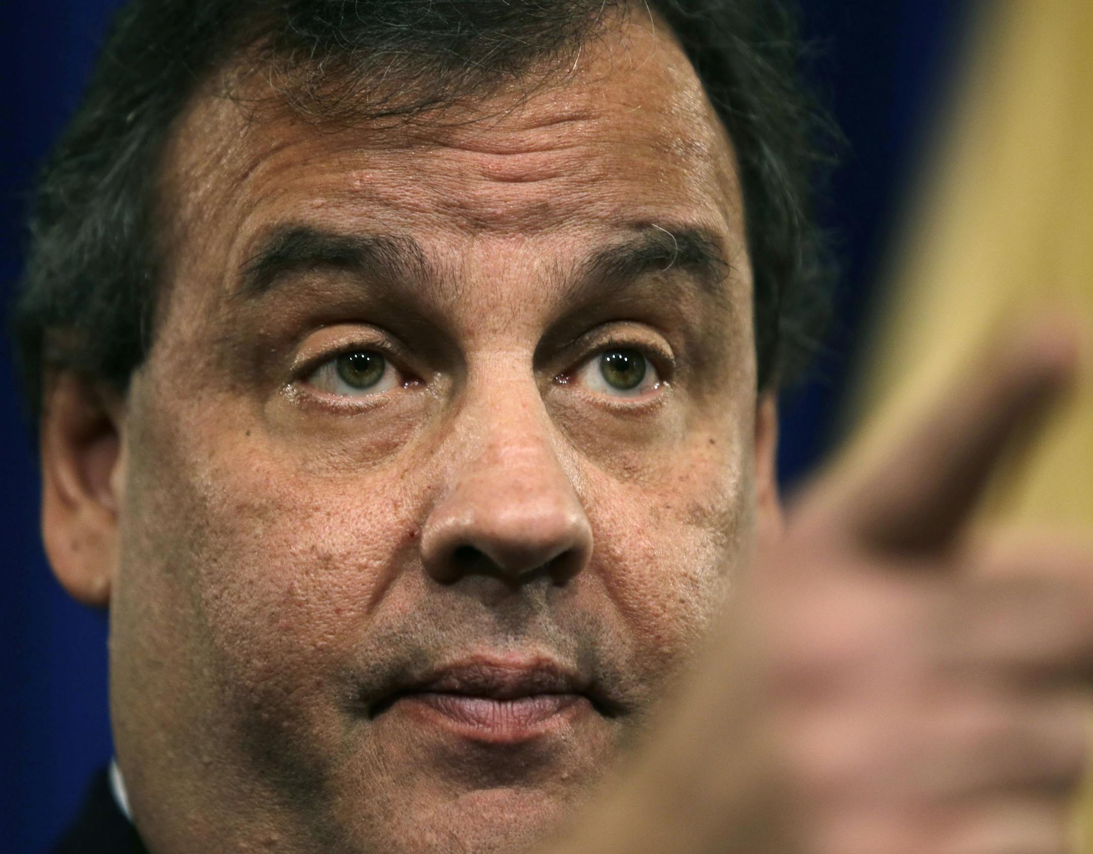 New Jersey Gov. Chris Christie gestures during a news conference Thursday, Jan. 9, 2014, at the Statehouse in Trenton, N.J. Christie has fired a top aide who engineered political payback against a town mayor, saying she lied. Deputy Chief of Staff Bridget Anne Kelly is the latest casualty in a widening scandal that threatens to upend Christie's second term and likely run for president in 2016. Documents show she arranged traffic jams to punish the mayor, who didn't endorse Christie for re-electi