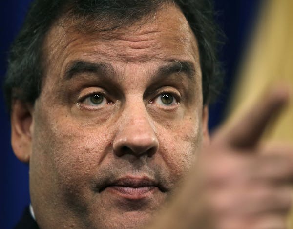New Jersey Gov. Chris Christie gestures during a news conference Thursday, Jan. 9, 2014, at the Statehouse in Trenton, N.J. Christie has fired a top a