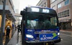 Riders hopped on the C-Line rapid transit bus in downtown Minneapolis on Oct. 22. Metro Transit is weighing cuts to two express routes from Bloomin
