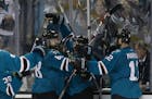 San Jose Sharks right wing Joonas Donskoi, from Finland, center, celebrates with teammates after scoring the winning goal during overtime of Game 3 of