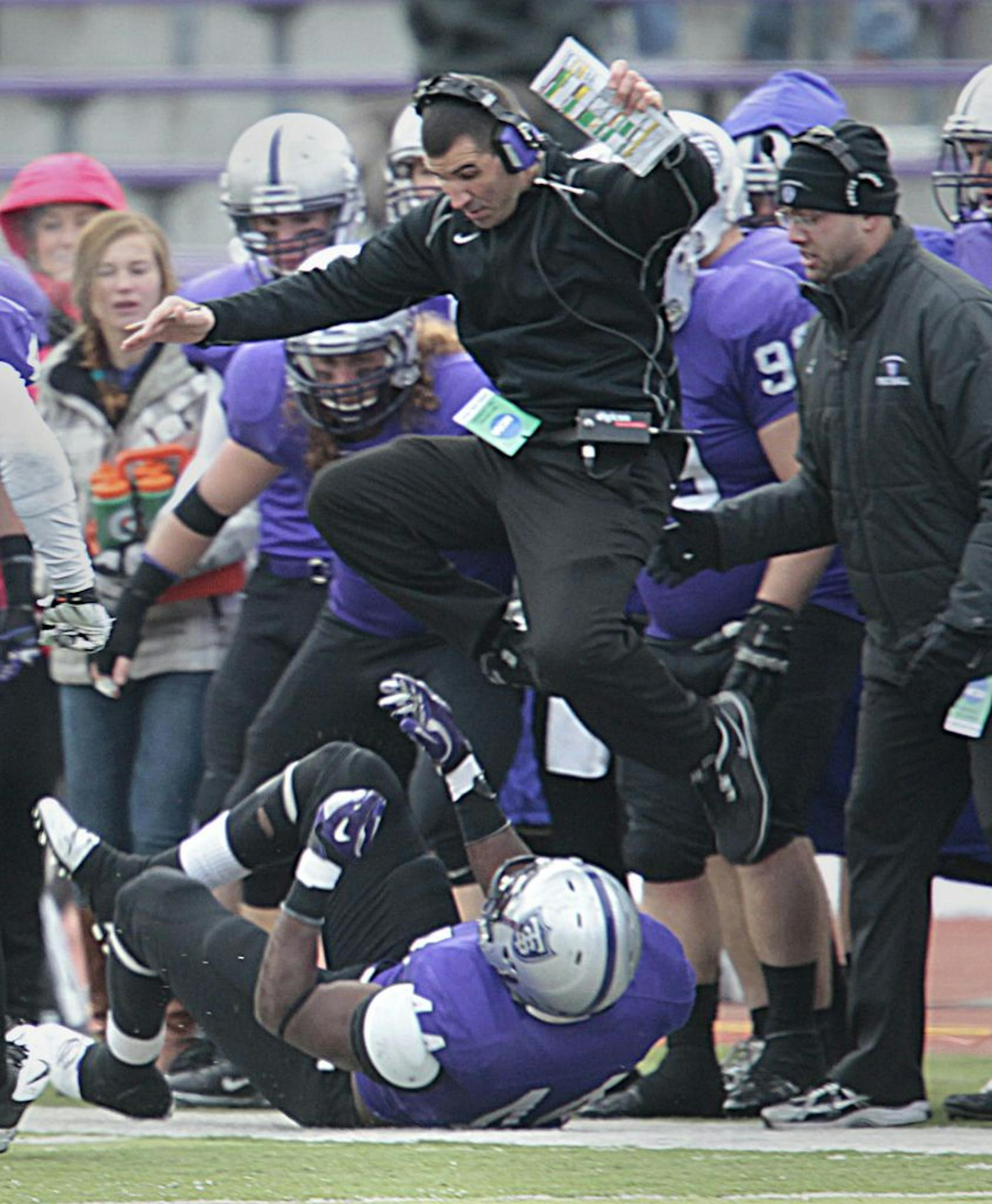 Ayo Idowu's pursuit of a fumble took him right into St. Thomas coach Glenn Caruso during a playoff victory against Elmhurst.