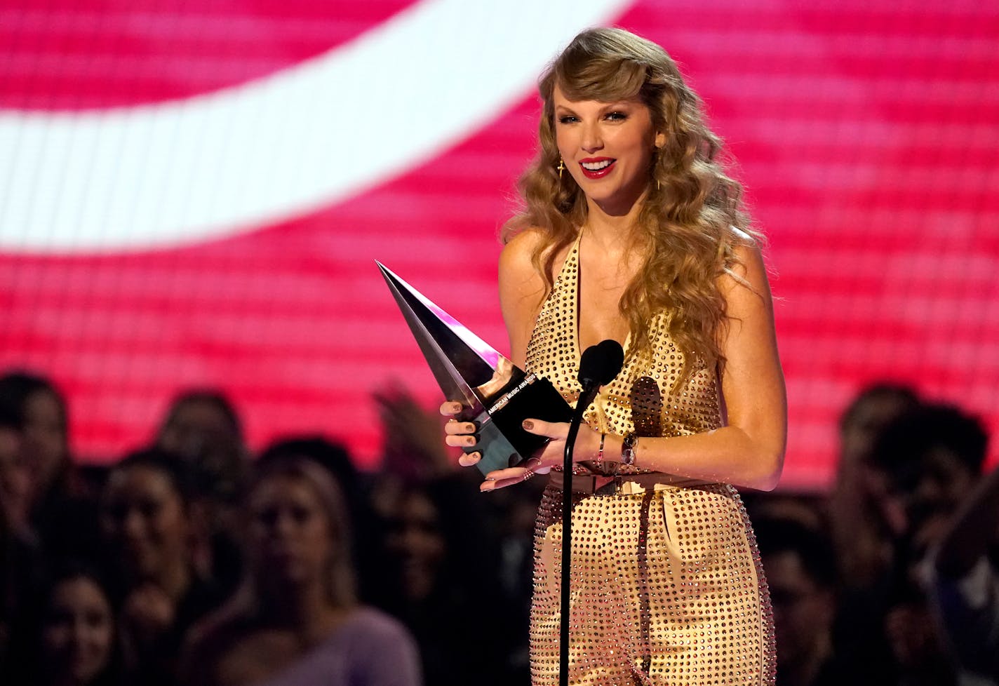 Taylor Swift accepts the award for favorite pop album for "Red (Taylor's Version)" at the American Music Awards on Sunday, Nov. 20, 2022, at the Microsoft Theater in Los Angeles. (AP Photo/Chris Pizzello)