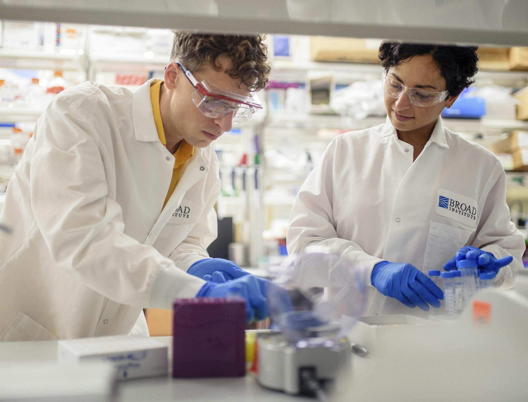 **EMBARGO: No electronic distribution, Web posting or street sales before 2:59 a.m. ET Tuesday, July 7, 2020. No exceptions for any reasons. EMBARGO set by source.** Sonia Vallabh, right, with her husband, Eric Minikel, at the Broad Institute in Cambridge, Mass., Nov. 23, 2019. They both conduct research on a degenerative brain disease she has. Faced with illnesses that most scientists overlook and that have no known therapies, people are working on their own to find treatments for their childre