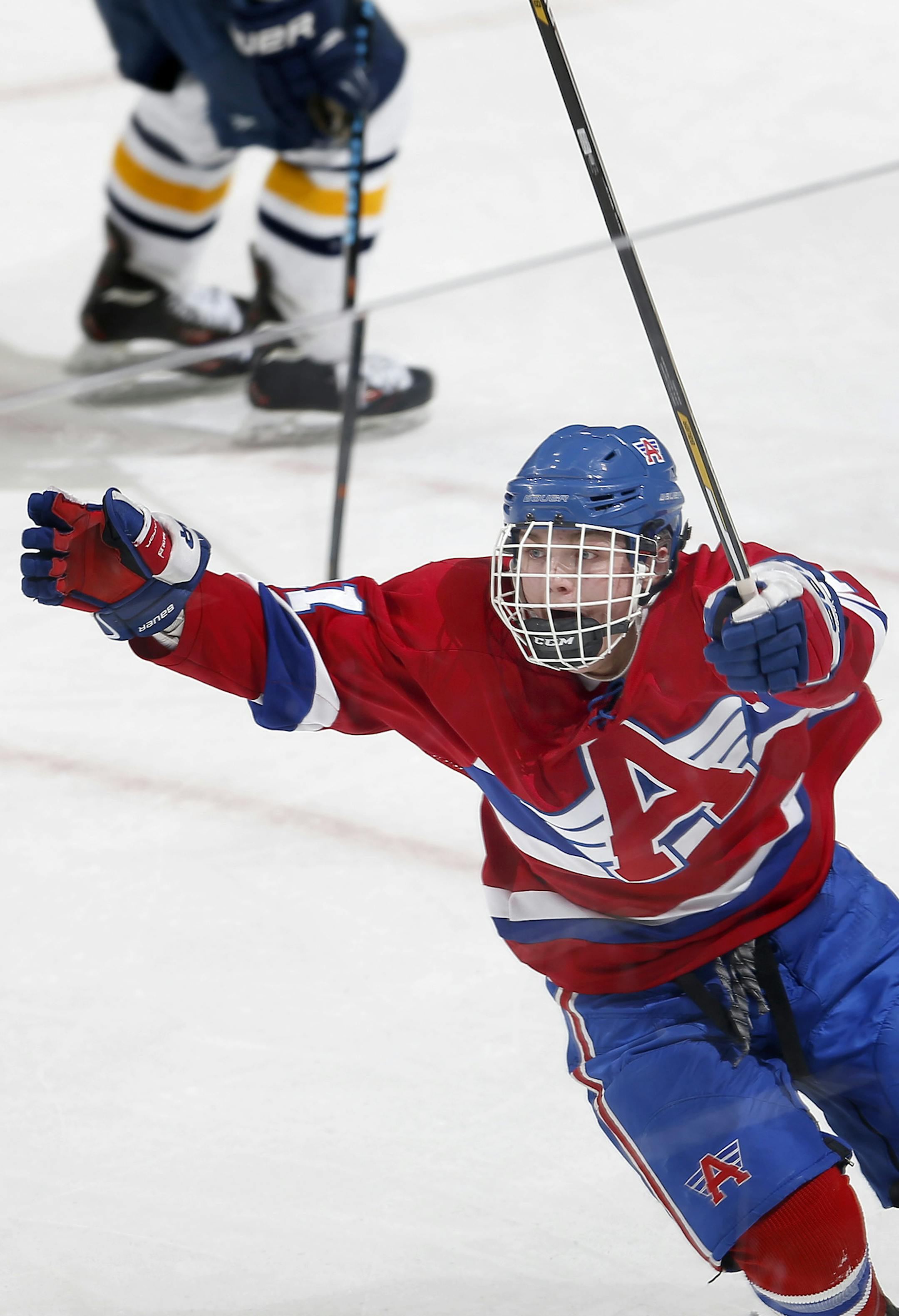 Brandon Bissett (21) celebrated after making the game winning goal in overtime. ] CARLOS GONZALEZ cgonzalez@startribune.com, March 4, 2015, St. Paul, MN, Xcel Energy Center, Minnesota boys hockey state tournament quarterfinals, Class 1A, St. Cloud Apollo vs. Breck