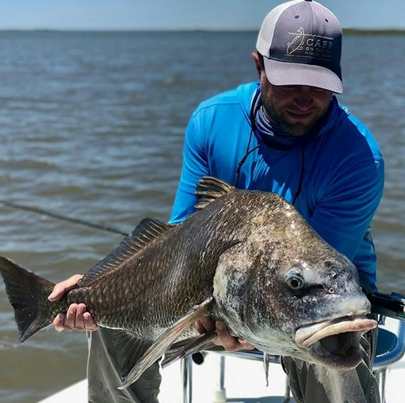 Watkins with a black drum he caught from Lake Michigan.