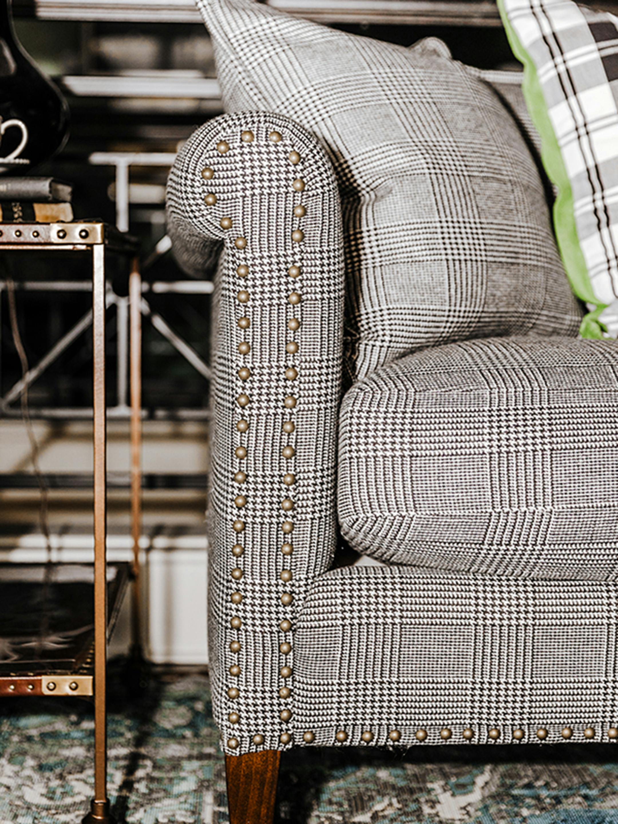 Inspired by men's classic suit styles, any material from pinstripes to plaid or herringbone to houndstooth can be used to bring masculine charm to a space. (Provided photo/TNS)