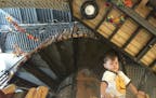 Berit Thorkelson&#x2019;s son looks down from the Tree of Forts Climber at the Children&#x2019;s Museum of Southern Minnesota in Mankato.