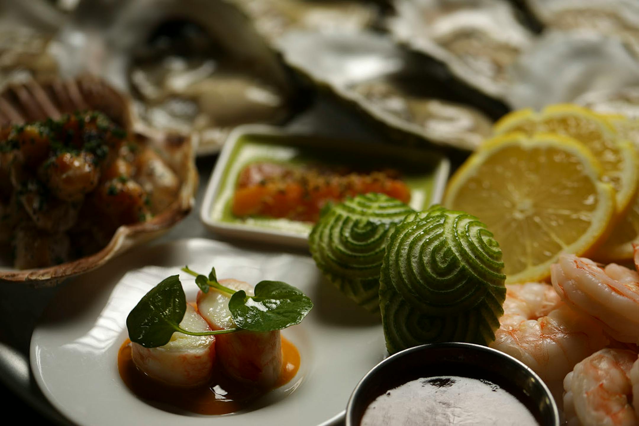 Detail of the chilled seafood platter, with oysters, shrimp cocktail, tuna tiradito, smoked bay scallops, crab with carrot mayo, crudo & accompaniments, as prepared at Martina Wednesday evening.