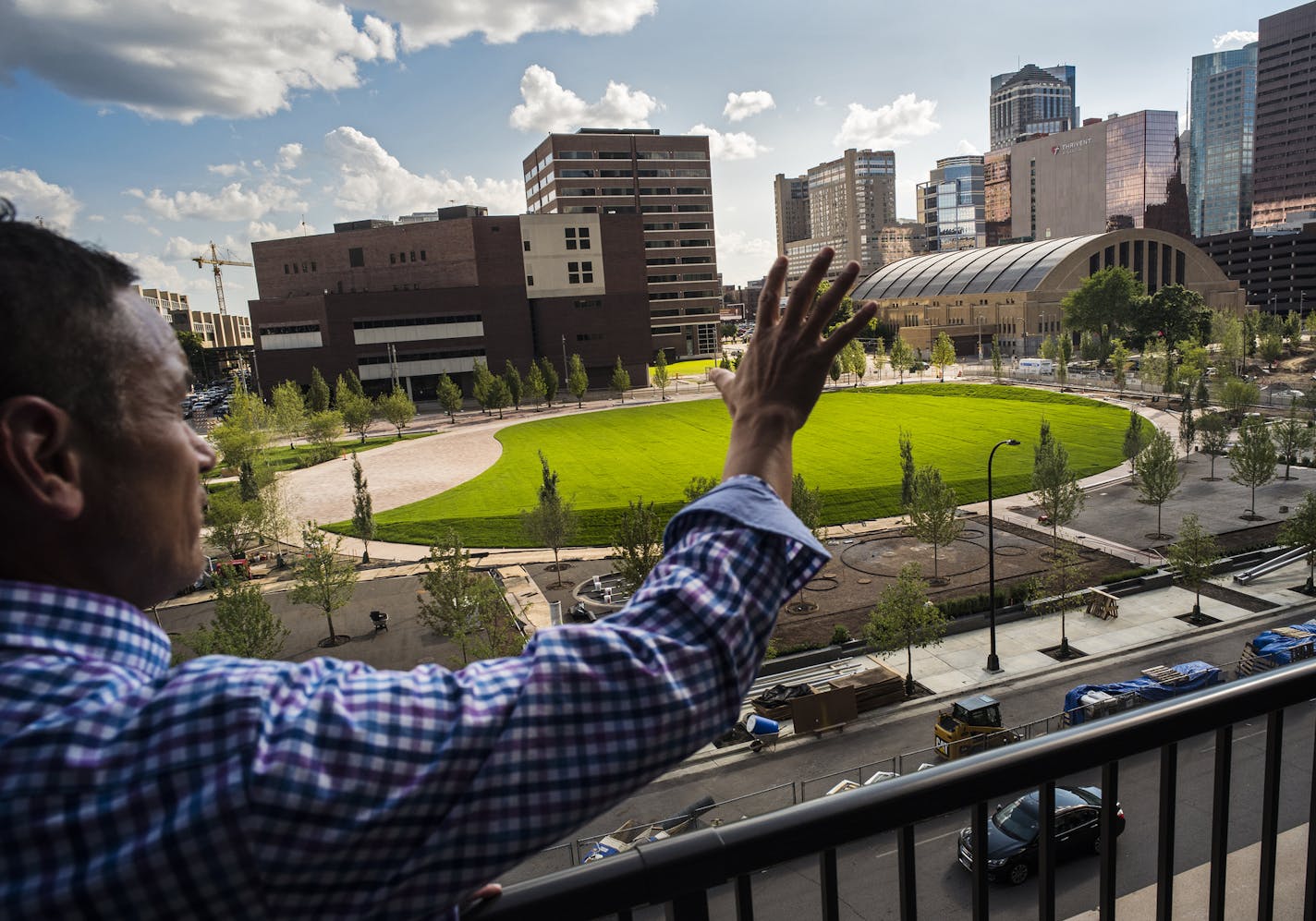 With downtown landmark the Armory in the distance to the right, leasing agent Nick Torrez gestured from the new Edition building that overlooks Minneapolis&#x2019; latest purchase: The Commons park in Downtown East.