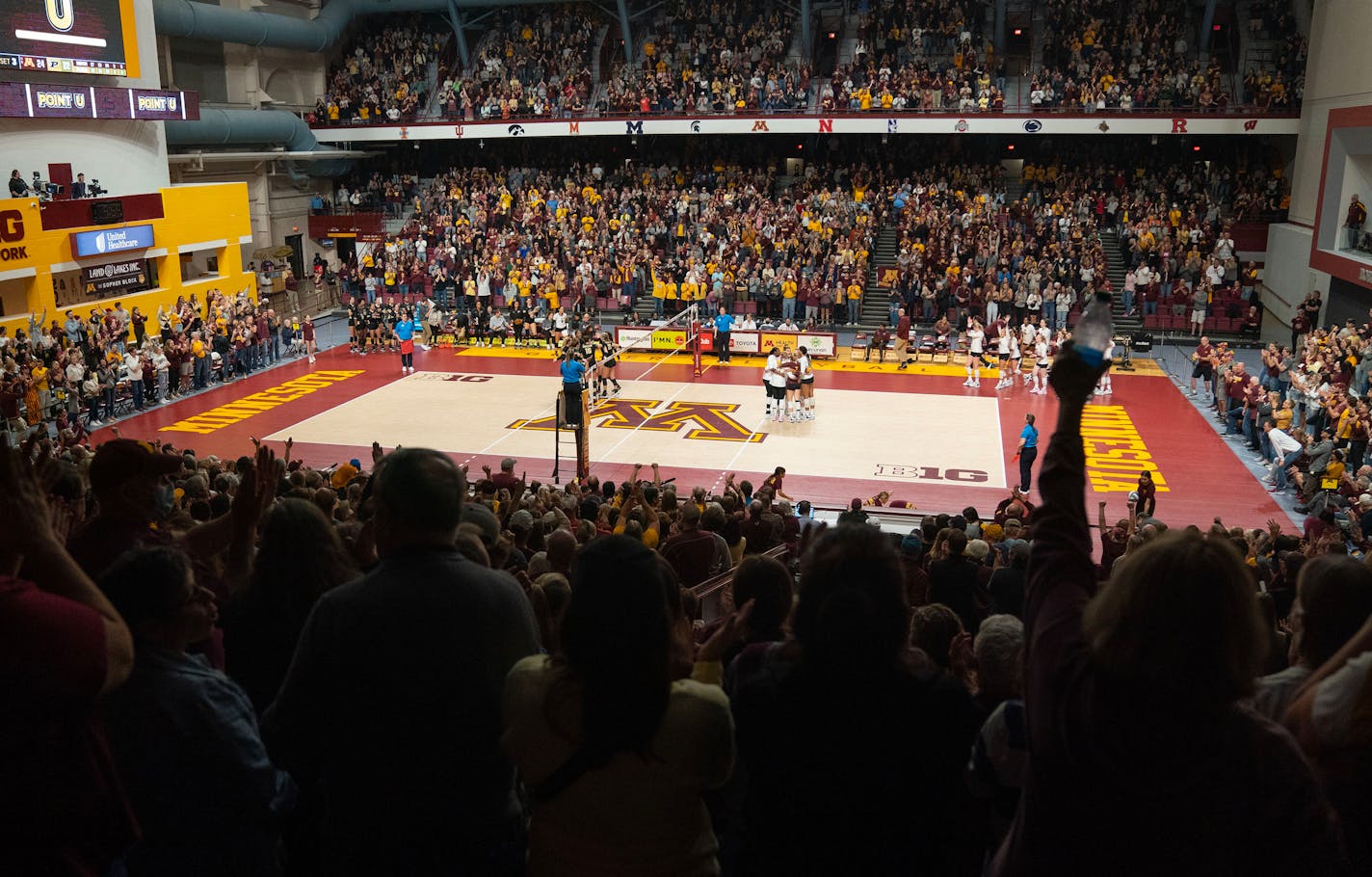 The Minnesota volleyball team celebrates after winning a point and the set against Purdue in the third set Saturday, Oct. 22, 2022 at Maturi Pavilion in Minneapolis. ]