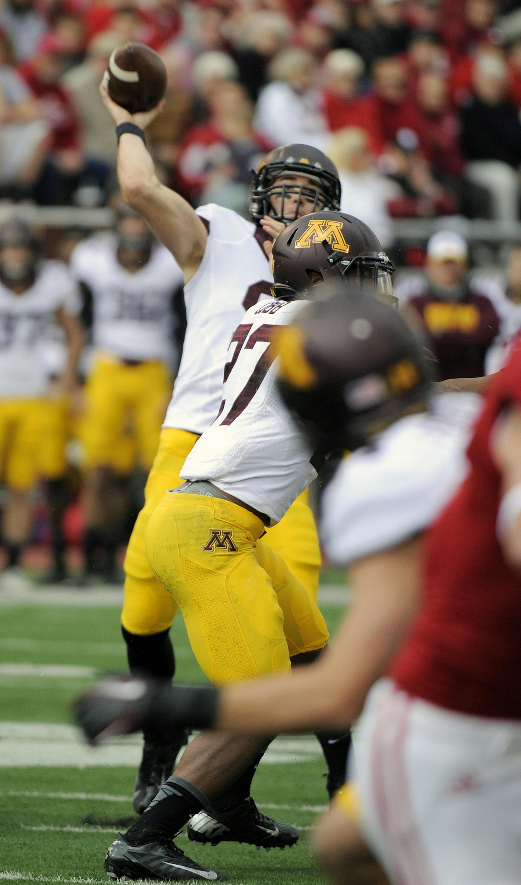 Minnesota's Philip Nelson throws during the first half of an NCAA college football game against Indiana in Bloomington, Ind., Saturday, Nov. 2, 2013. (AP Photo/ Alan Petersime)