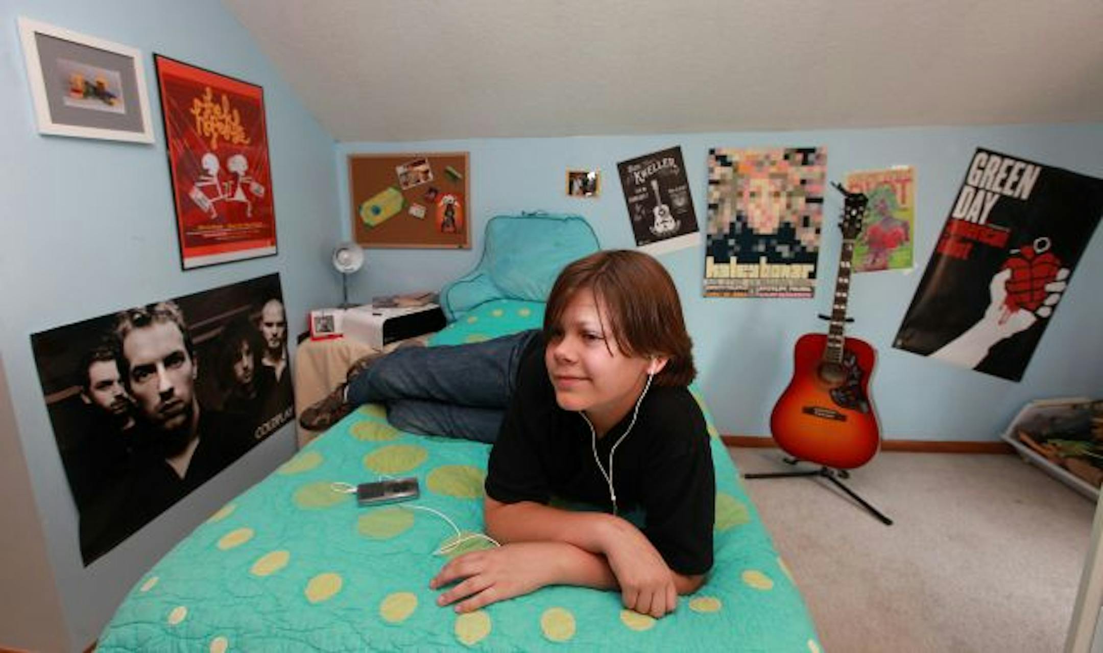 The walls in Max Timander's room testify to his love of music, with posters from local and national bands.