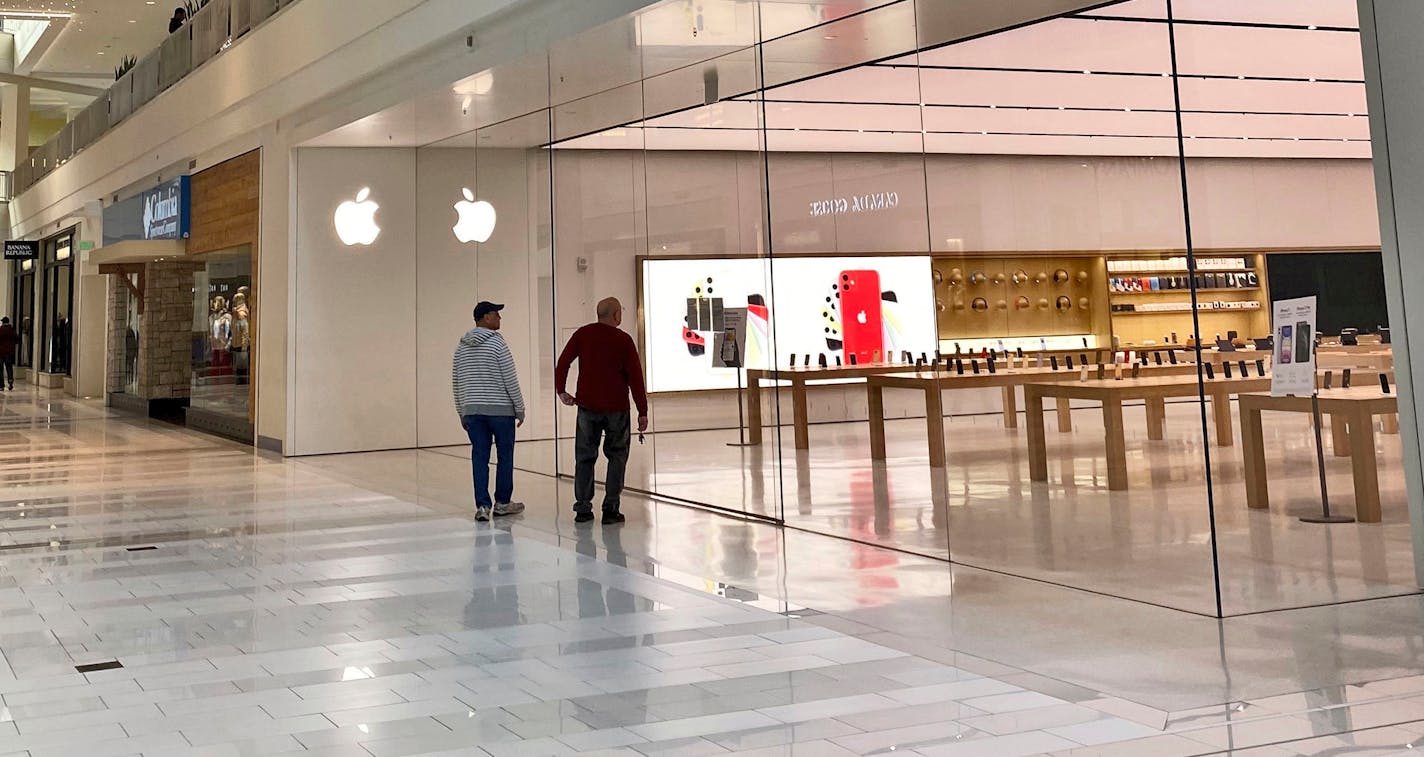 Shoppers looked into the closed Apple Store at the Mall of America on Tuesday in Bloomington. In Minnesota, 4% of the state's workforce sought unemployment benefits last week.