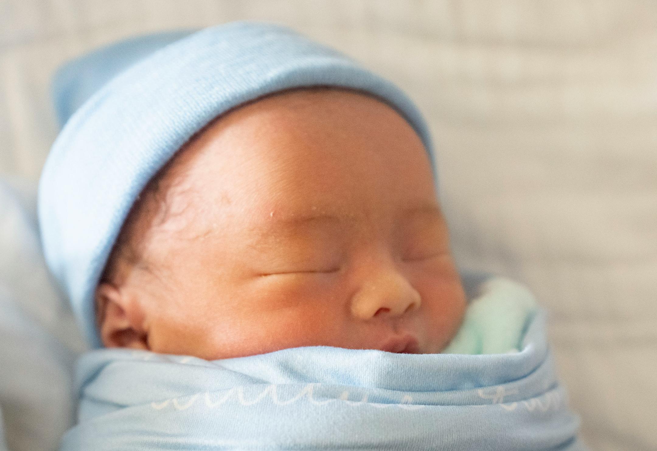 Atticus Vang rests in his bed Thursday, March 24, 2022 at Maple Grove Hospital in Maple Grove, Minn. Vang was born March 23, 2022.
