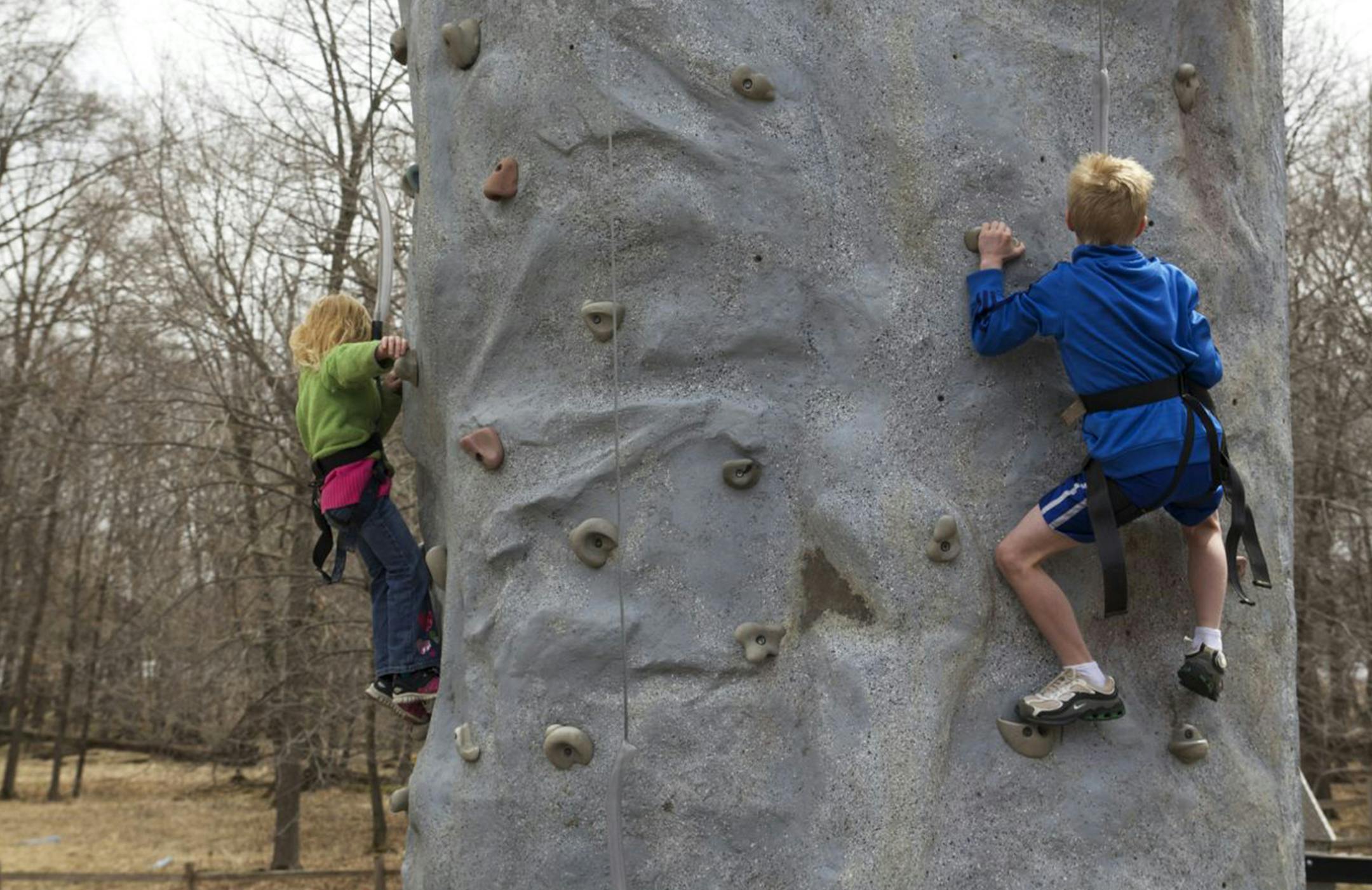 Kids climbed a climbing wall at Wargo Nature Center last year during their Earth Day event.