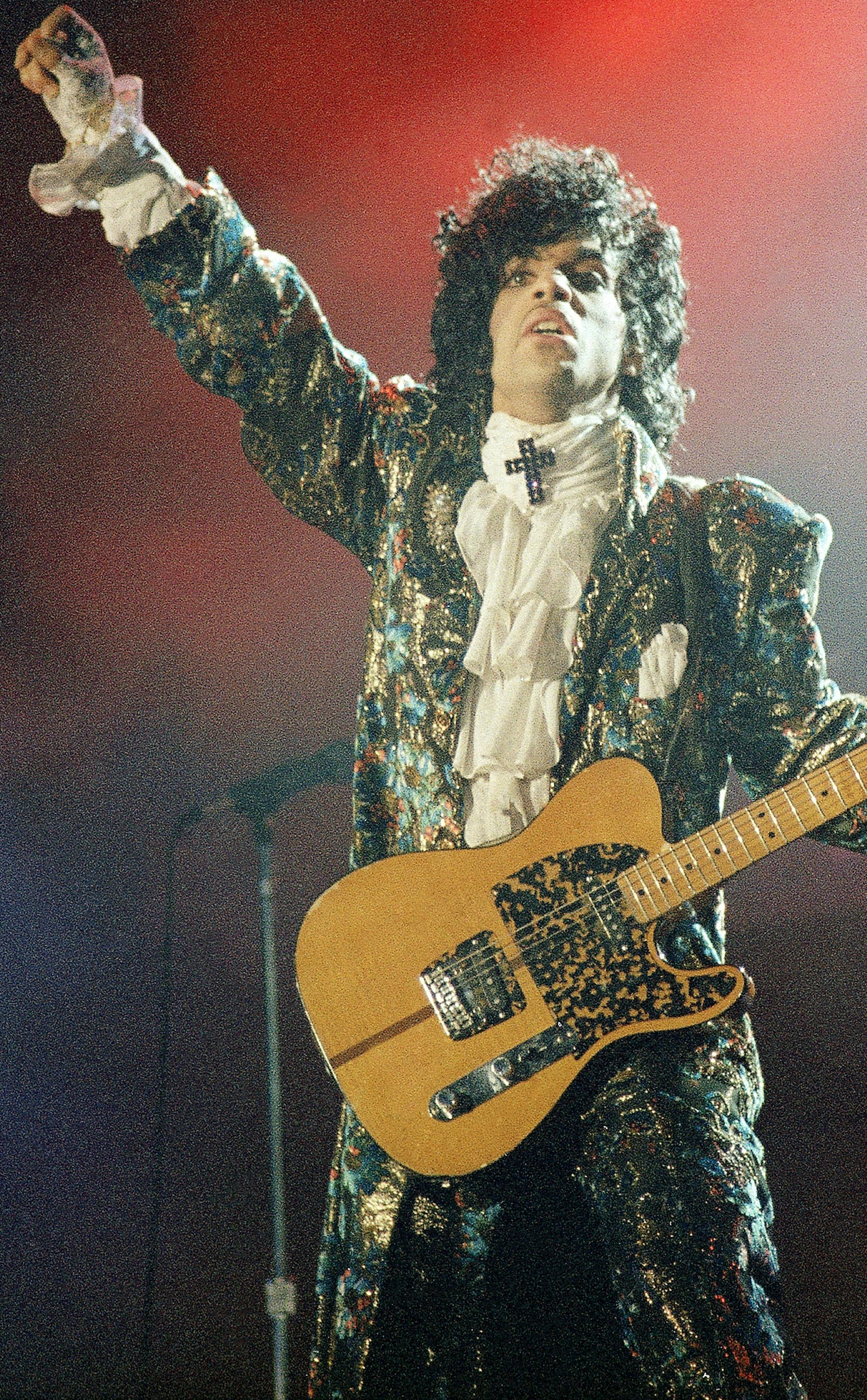 Oscar-winning rock singer Prince gives his final performance in Miamiís Orange Bowl, Easter Sunday, April 8, 1985, before a crowd of an estimated 55,000 fans. (AP Photo/Phil Sandlin) ORG XMIT: APHS381643
