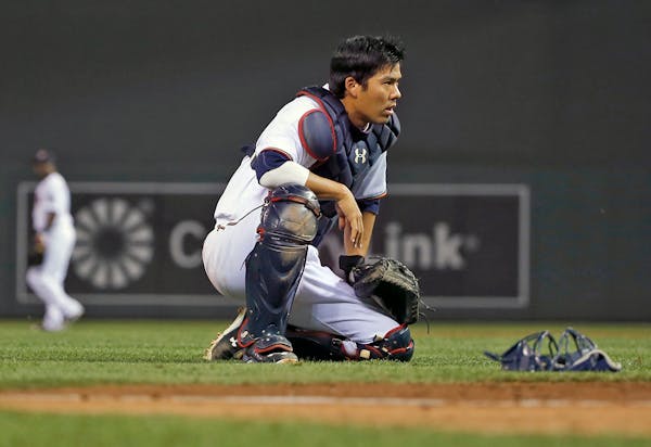 Kurt Suzuki #8 of the Minnesota Twins paused after an infield pop up got away from the team during the eighth inning. ] (KYNDELL HARKNESS/STAR TRIBUNE