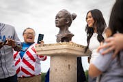Suni Lee and her family were surprised Sunday with a bust of Lee at Phalen Regional Park in St. Paul.