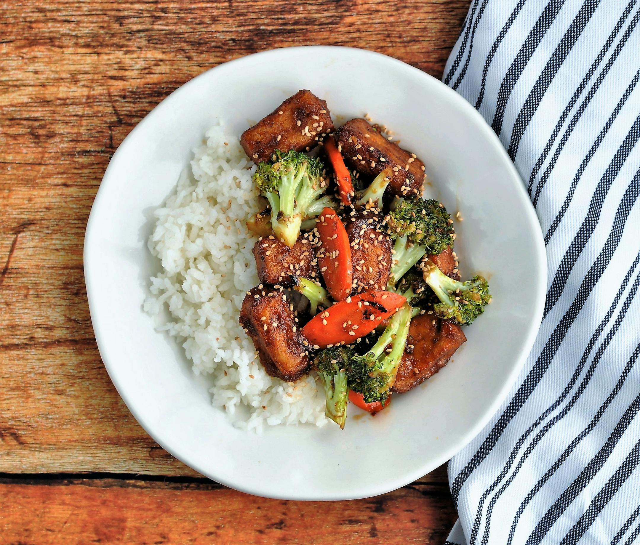 Soy Honey-Glazed Crispy Tofu with Broccoli and Carrots. Credit: Meredith Deeds, Special to the Star Tribune