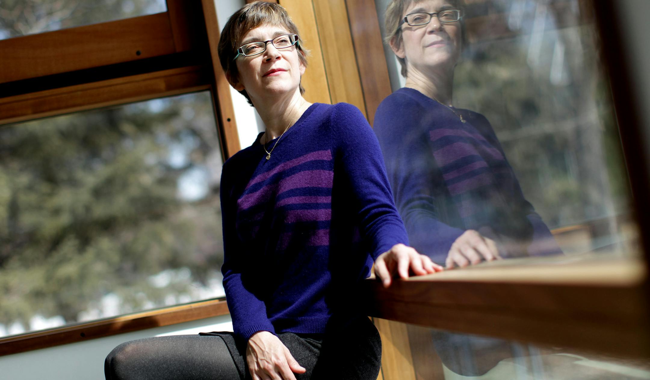 Sarah Schultz, Director of Education and Community Programs, sits in the FlatPak House at the Walker Art Center March 28, 2013. Originally part of an exhibition of contemporary prefabricated houses in 2005, the one-room FlatPak now hosts a variety of educational and experiential activities for both kids and adults. (Courtney Perry/Special to the Star Tribune)