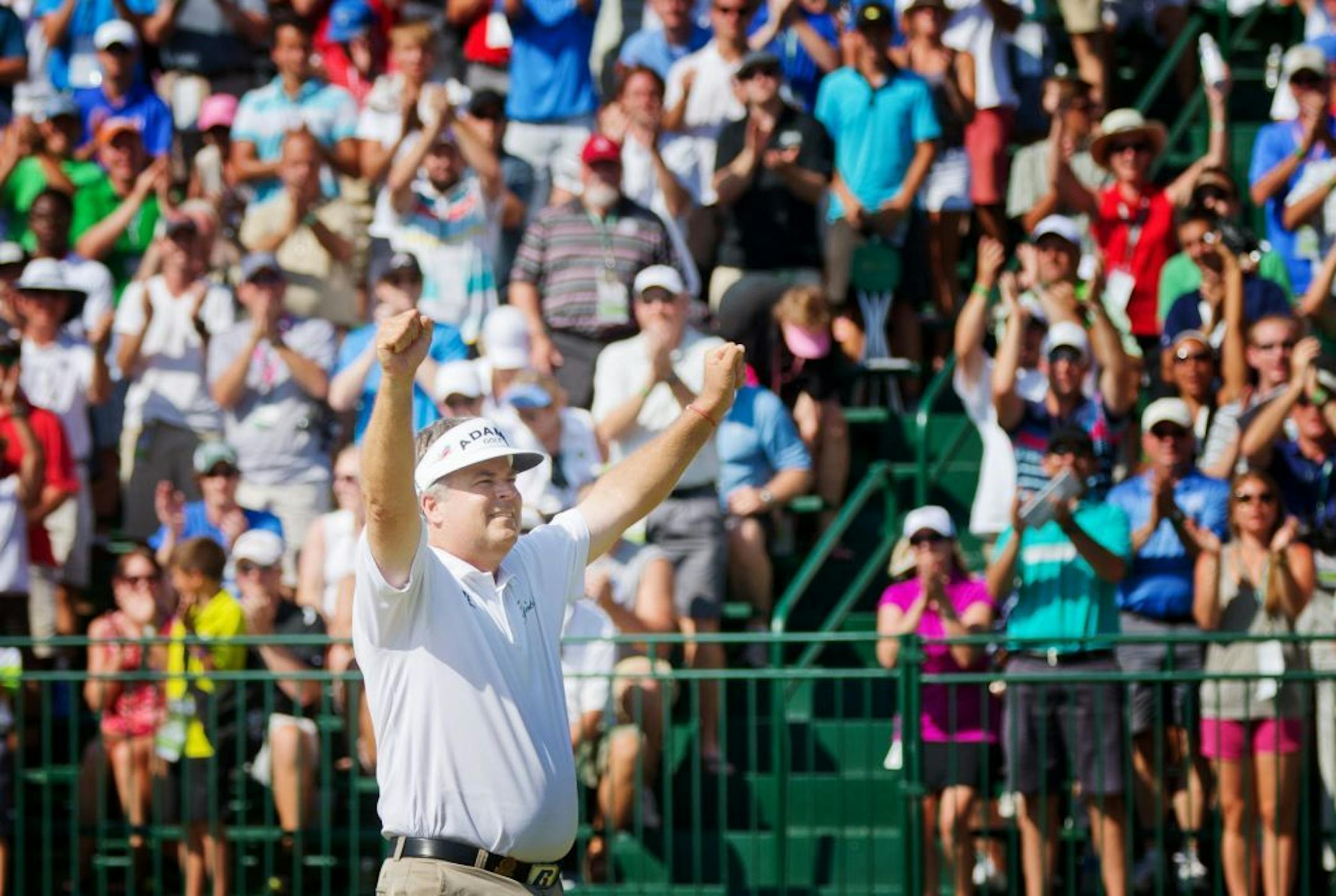 Kenny Perry celebrates his victory after his winning the U.S. Senior Open golf tournament on Sunday, July 14, 2013. (AP Photo/The Omaha World-Herald/Alyssa Schukar)� MAGAZINES OUT; All LOCAL TV OUT