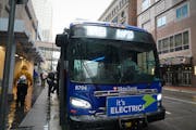 Riders hopped on the C-Line Rapid Transit bus on 7th Street in downtown Minneapolis on a cold, wet Thursday, October 22, 2020.



 ]  Shari L. Gross �