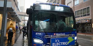 Riders hopped on the C-Line Rapid Transit bus on 7th Street in downtown Minneapolis on a cold, wet Thursday, October 22, 2020.



 ]  Shari L. Gross �