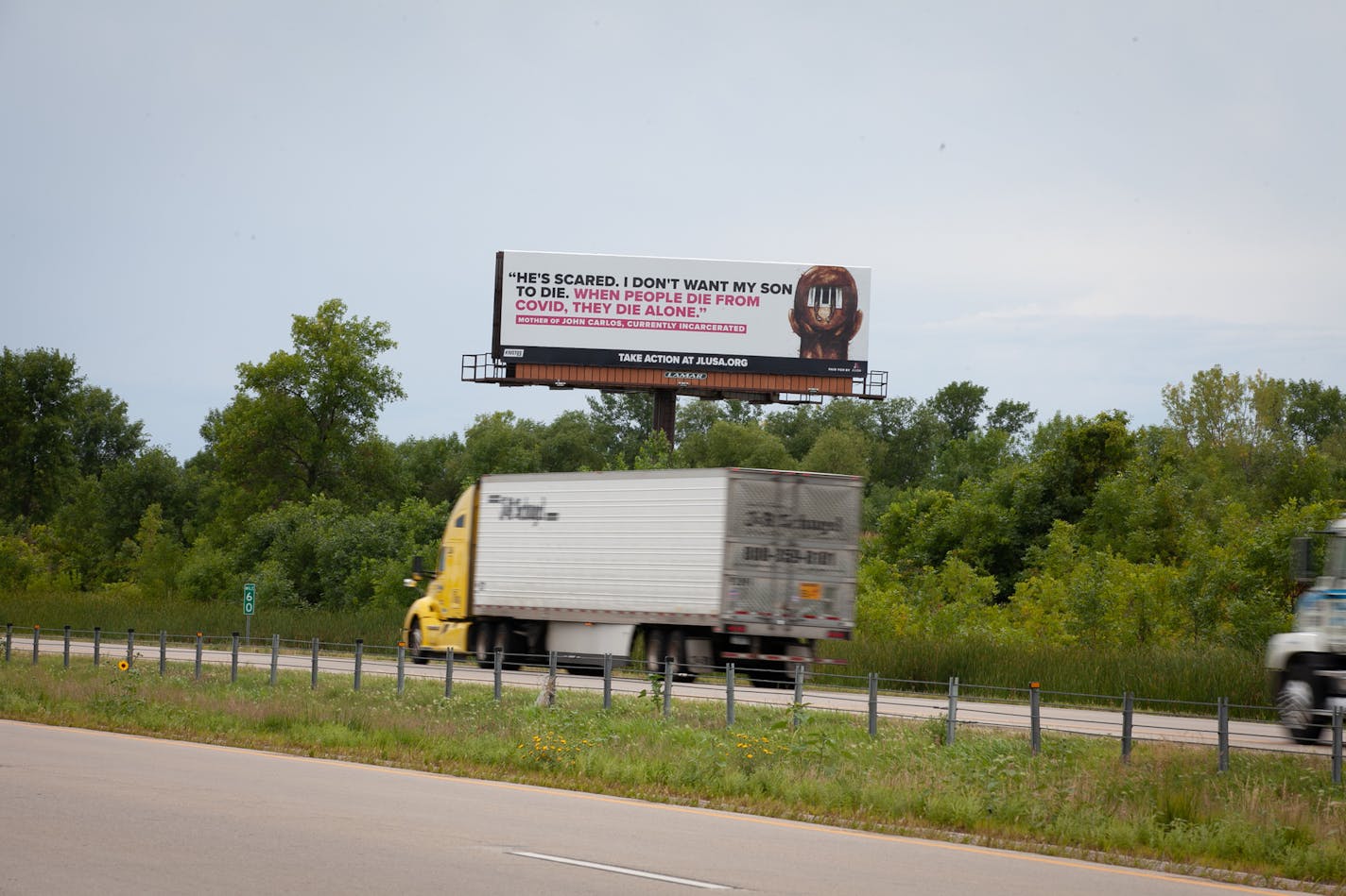 Hoping to encourage empathy for people incarcerated during the pandemic, JustLeadershipUSA put up billboards outside prisons across the country. This one, in Faribault, quotes the mother of an incarcerated son: "When people die from COVID, they die alone." Photo by Rebecca J. Lawrence Photography