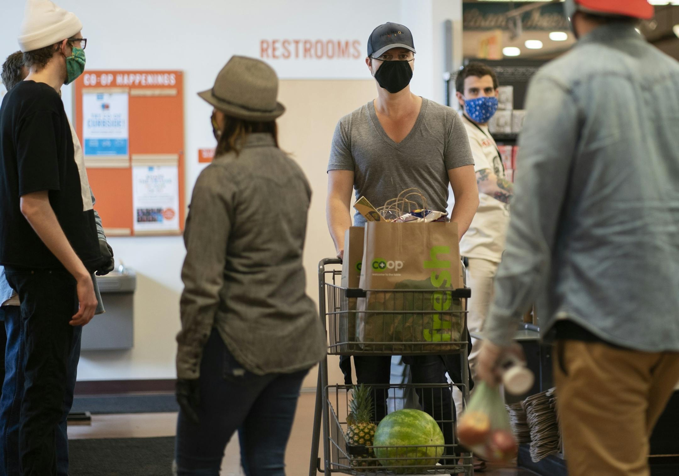 Kyle Hale finished his shopping at Linden Hills Coop. Starting at 5 p.m. Tuesday, shoppers in Minneapolis will be required to wear masks.