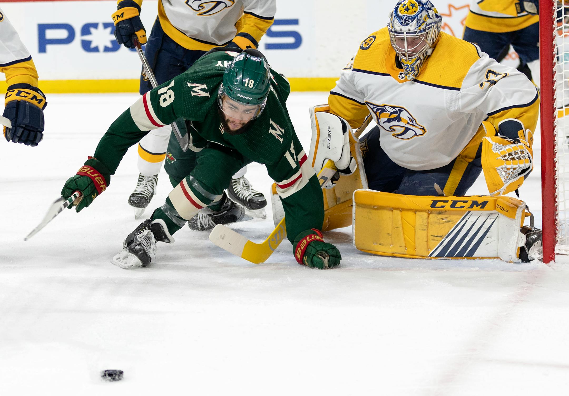 Jordan Greenway (18) of the Minnesota Wild and Nashville Predators goalie David Rittich (33) in the first period.