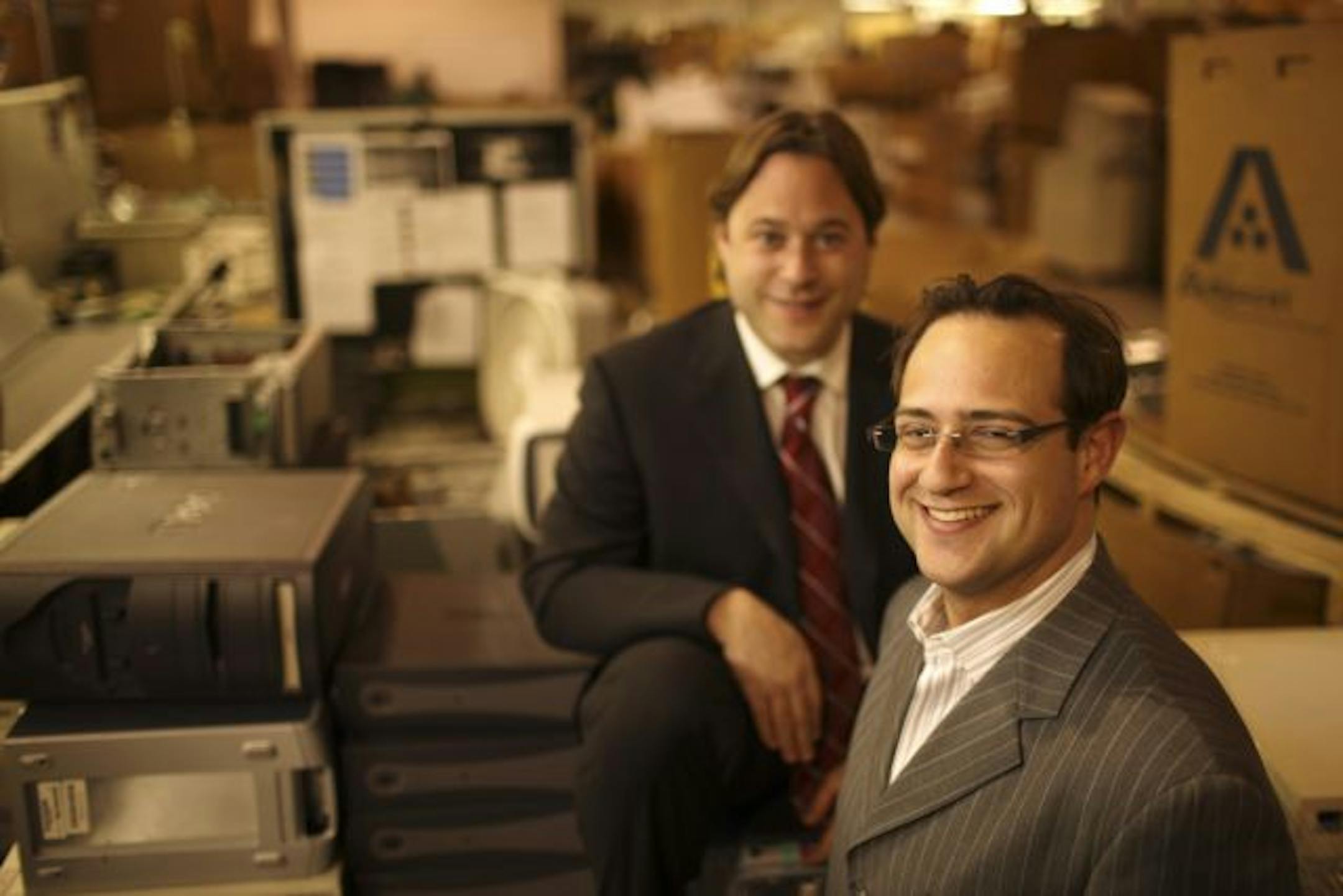 David Kutoff, foreground, and Todd Schachtman of MPC in their processing center in Eagan Monday afternoon.