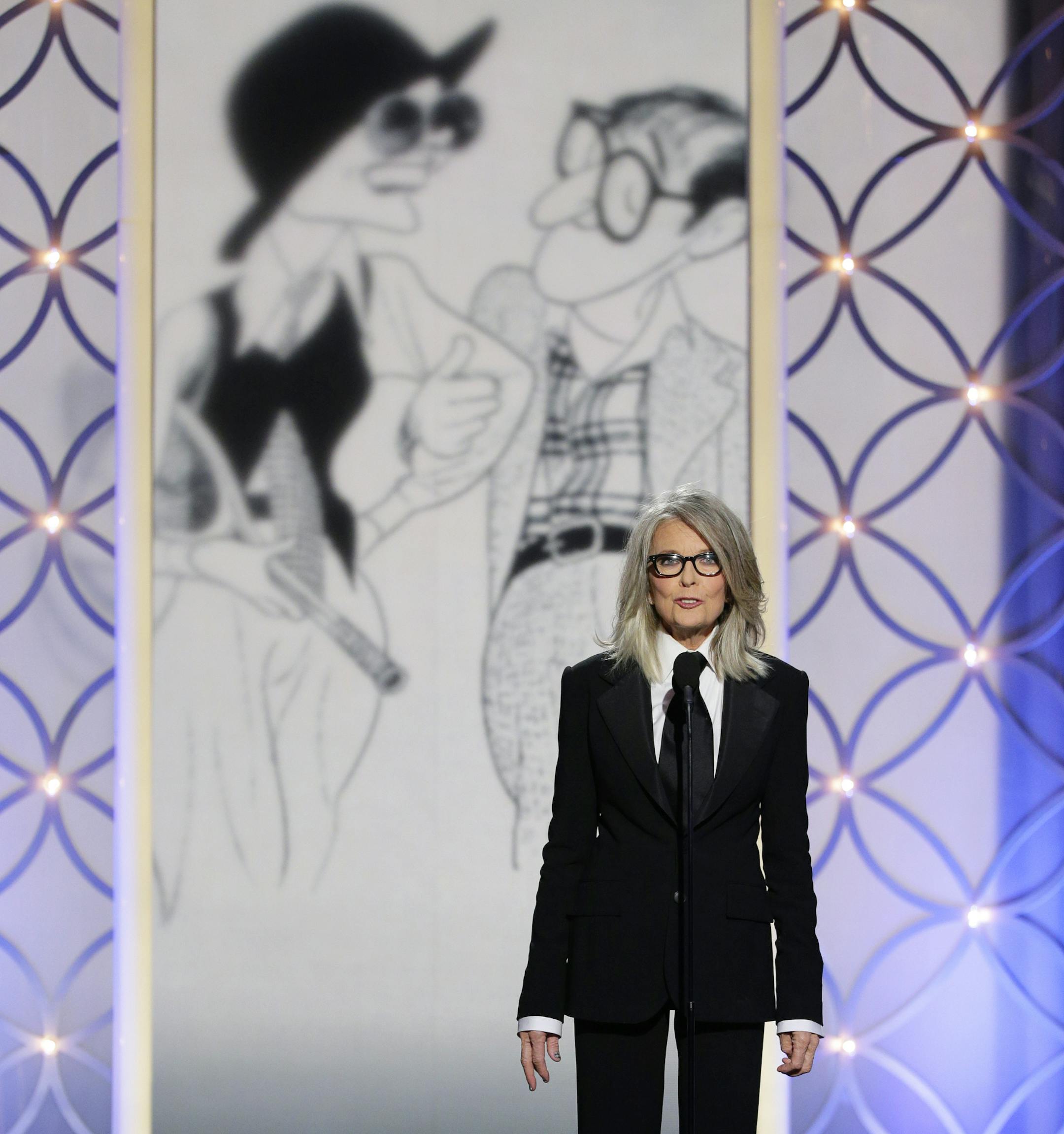 This image released by NBC shows Diane Keaton accepting the Cecil B. DeMille award on behalf of Woody Allen during the 71st annual Golden Globe Awards at the Beverly Hilton Hotel on Sunday, Jan. 12, 2014, in Beverly Hills, Calif. (AP Photo/NBC, Paul Drinkwater)