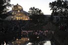 Lanterns floated in the Frog Pond near the Marjorie McNeely Conservatory in Como Park at dusk Sunday night. ] JEFF WHEELER &#xef; jeff.wheeler@startri