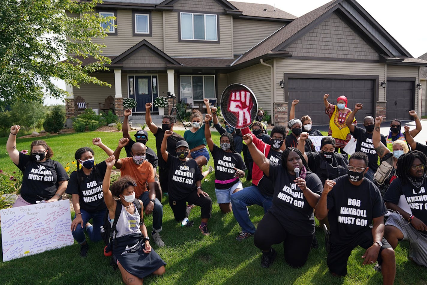 Black Black Lives Matter protesters led by Nekima Levy Armstrong and Toussaint Morrison were among about 100 protesters outside the home of Minneapolis Police Federation president Bob Kroll and his wife, WCCO reporter Liz Collin, in Hugo on Aug. 15.