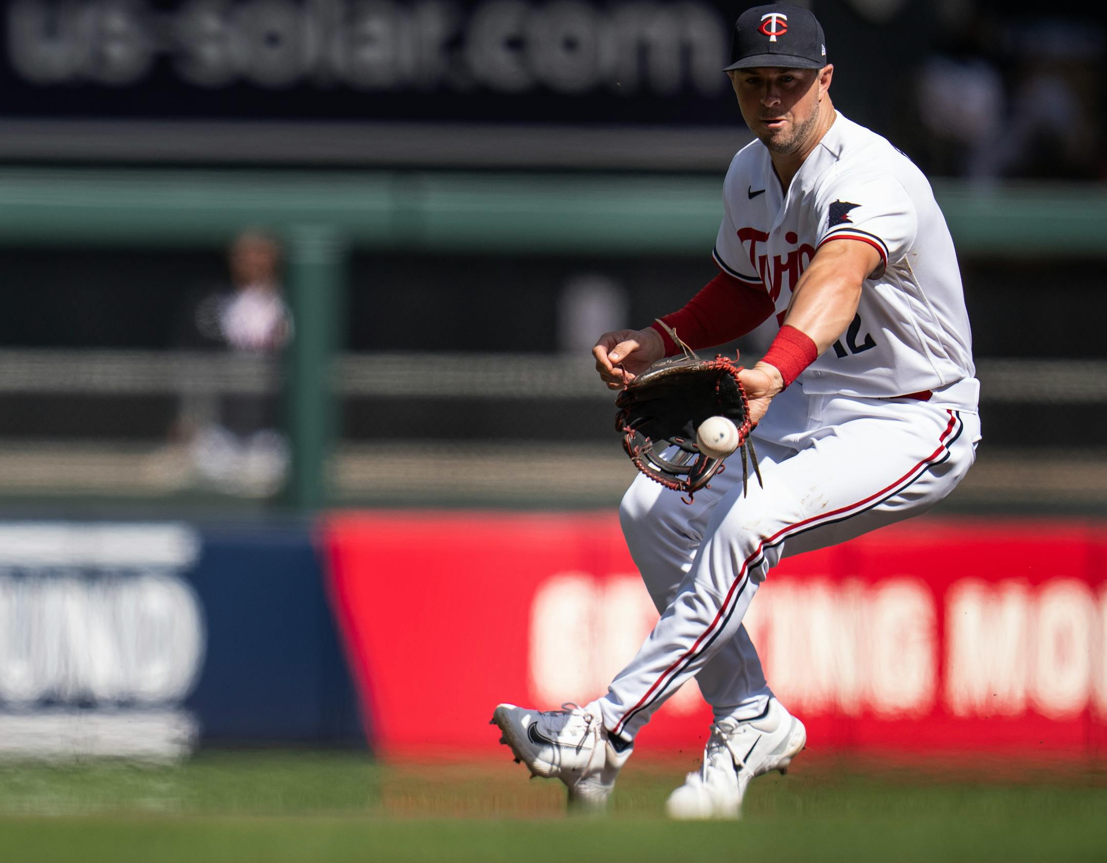 Minnesota Twins third baseman Kyle Farmer fielded a ground ball hit by Chicago White Sox first baseman Andrew Vaughn for an out in the eighth inning.