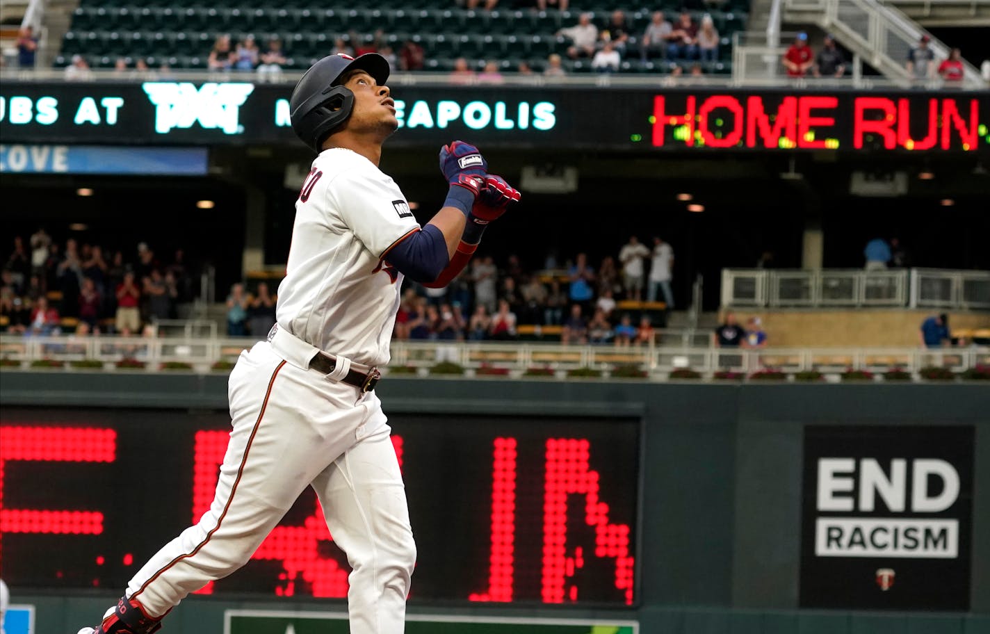 The Twins' Jorge Polanco jogs home on a solo home run off Kansas City pitcher Brady Singer in the first inning